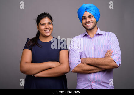 Young happy Indian couple together and in love smiling Stock Photo