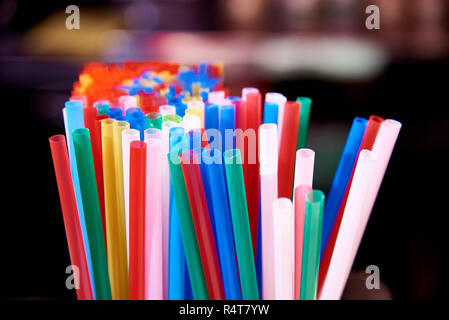 Bright multicolored straws for cocktails close-up. Stock Photo