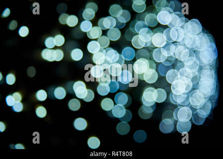 Abstract glitter bokeh on black background. Stock Photo