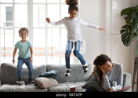 African American woman having problem with children upbringing Stock Photo