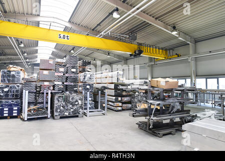 industrial hall in metalworking - storage of steel pipes for production Stock Photo