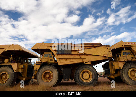 Giant industrial coal mining trucks used for open pit coal mining in the Powder River Basin of Wyoming / USA. Stock Photo