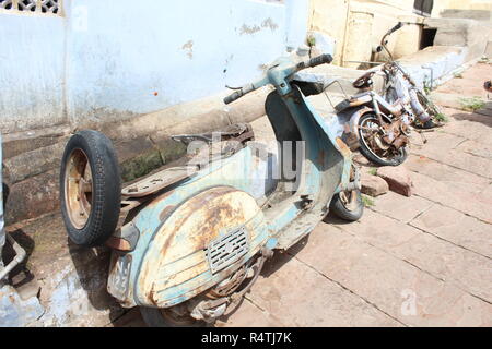 Old rusted abandoned motorcycle in desolate barn Stock Photo - Alamy