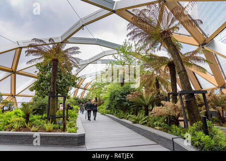 London, UK - April 28, 2018: Tourists visit the roof garden at Crossrail Place in Canary Wharf Stock Photo