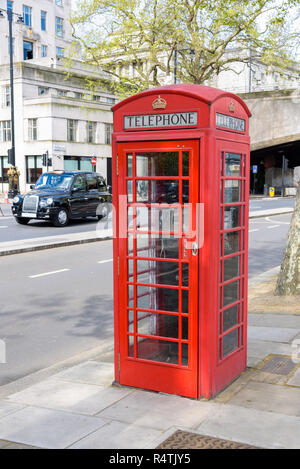 Traditional british red telephone booth in London, UK Stock Photo