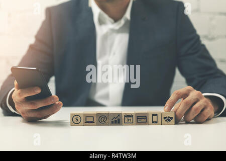 busy businessman using smatphone at office multitasking concept Stock Photo
