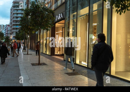 Valencia,Spain - November 25, 2018: Zara store in Valencia. Zara is a Spanish clothing and accessories retailer Zara store. People walking in and out Stock Photo
