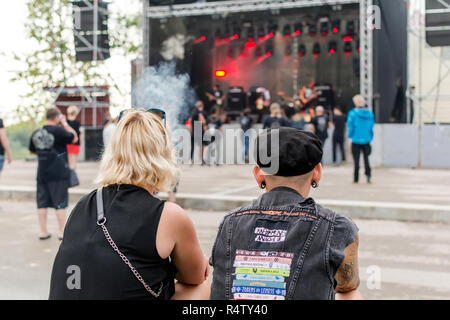 Jekabpils, Latvia - August 3, 2018: Heavy metal fans looking at stage during band performance at Metalshow Open Air festival in Latvia. Stock Photo