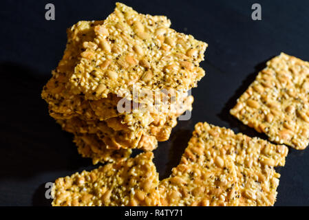 Stack of fresh and tasty homemade seed crackers. Stock Photo