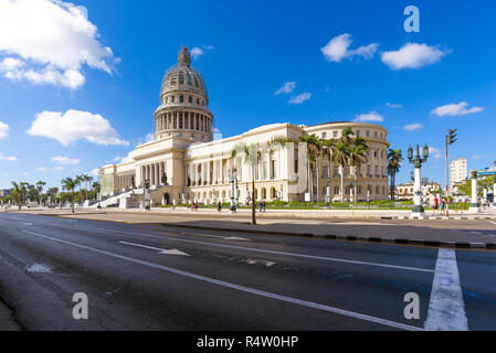 Old Havana, Cuba. Classic vintage American taxi cars pass in front of El Capitolio building on the streets of Habana Vieja. Stock Photo