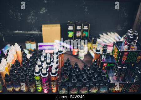 Ufa, Russia, South Vape Shop, 5 November, 2018: E-liquid e-juice High vape  for electronic cigarette vaping device , on counter in smoke vapor in vape  bar in bottles Stock Photo - Alamy