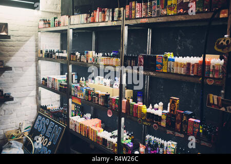 Ufa, Russia, South Vape Shop, 5 November, 2018: E-liquid e-juice High vape  for electronic cigarette vaping device , on counter in smoke vapor in vape  bar in bottles Stock Photo - Alamy