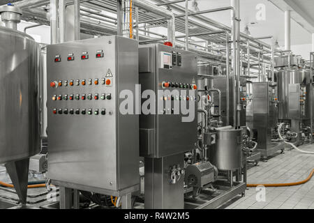electronic control panel and tank at a milk factory. equipment at the dairy plant Stock Photo