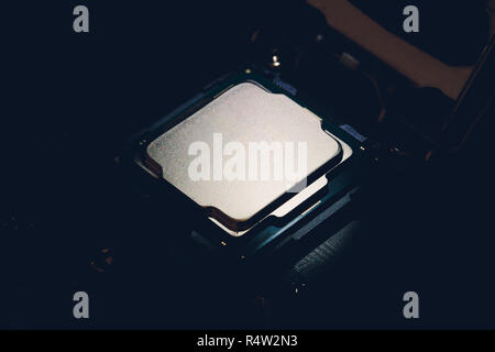 Electronic collection - CPU from the bottom side isolated on black background. in socket, motherboard Stock Photo