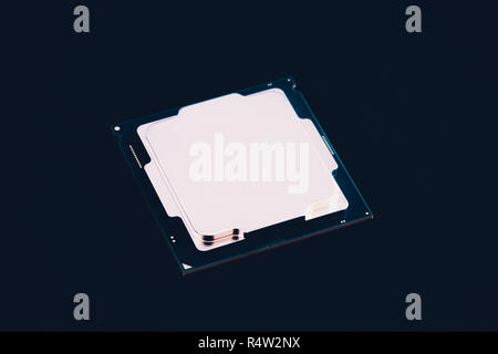 Electronic collection - CPU from the bottom side isolated on black background. Stock Photo