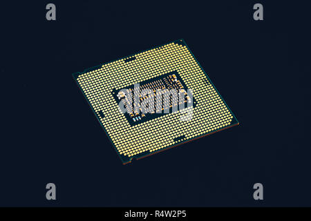 Electronic collection - CPU from the bottom side isolated on black background. Stock Photo