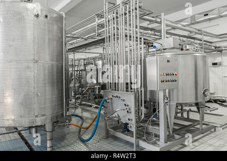 electronic control panel and tank at a milk factory. equipment at the dairy plant Stock Photo