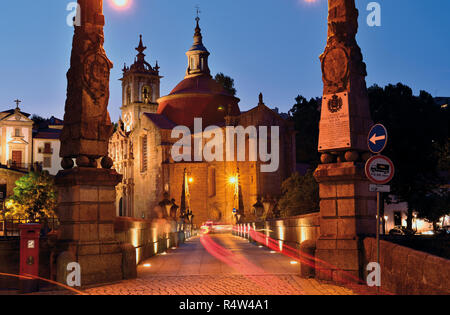 Nocturnal illuminated medieval bridge and convent in Amarante Stock Photo