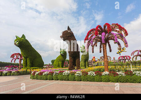 DUBAI, UAE - NOV 12, 2018: 4 (four) cats made of Flowers welcoming tourists at entrance at Miracle Garden in Dubai. United Arab Emirates garden from M Stock Photo