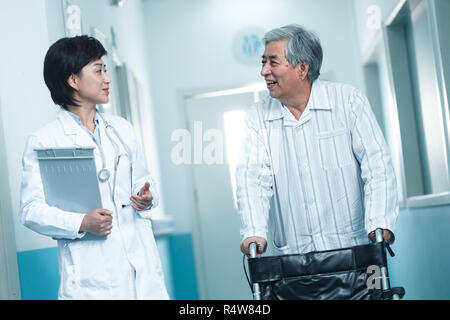 Doctors and older men in the hospital corridor Stock Photo