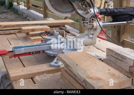 Electric saw and cut boards at a construction site Stock Photo