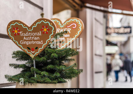 Vienna, Austria - December 30, 2017. Gingerbread bakery signs with traditional cookies in heart shape and text. Close view of plate with ornament and  Stock Photo