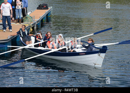 Shetland rowing regatta being held in Hamnavoe Burra in the Shetland Islands during the summer. Local teams race for each district