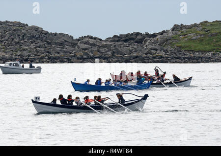 Shetland rowing regatta being held in Hamnavoe Burra in the Shetland Islands during the summer. Local teams race for each district
