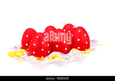 Easter eggs on ceramic setting isolated on white background. Stock Photo