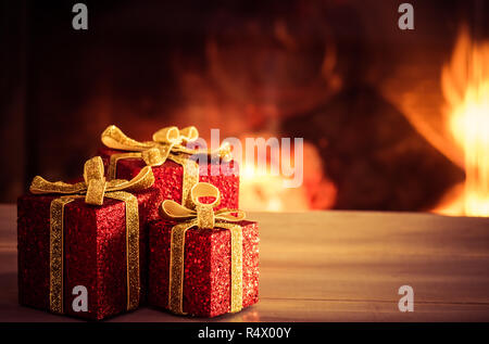 Christmas decoration with blurred fireplace in the background. Stock Photo
