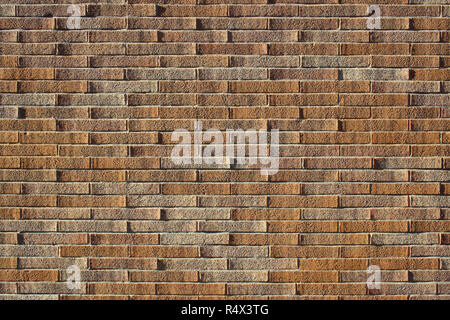 Perfect brick wall with lights and shadows of the setting. A brick wall with very regular, almost perfect geometries. The porosity of the bricks and Stock Photo
