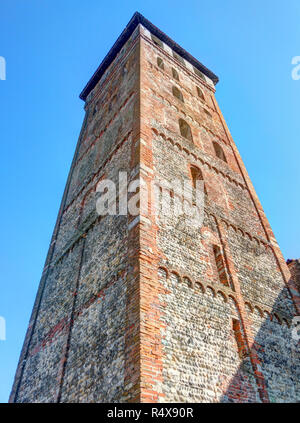 The round arch, cotto bricks and pebbles bell tower of the rural Saints Nazarius and Celsus abbey in San Nazzaro Sesia, Piedmont region, Italy Stock Photo