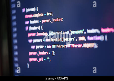 Colorful programming code on a computer monitor screen. Stock Photo