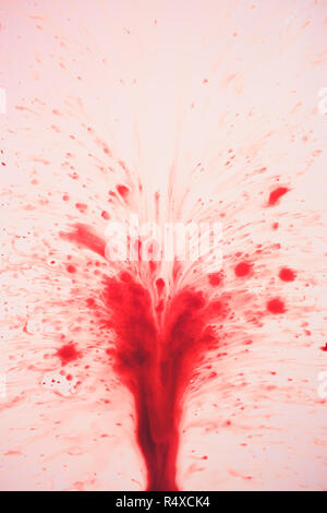 Red blood fountain on white background, health concept. Stock Photo