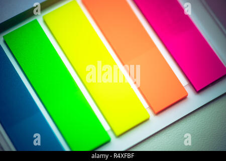 blurred background multicolored notes in a notebook with a white background Stock Photo