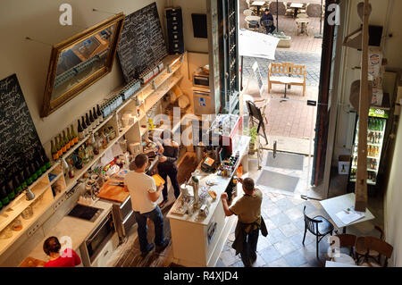 People working - waiting staff water and waitress and counter staff in a cafe Stock Photo