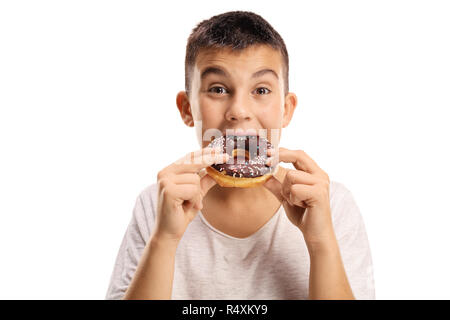 Young boy biting a donut isolated on white background Stock Photo