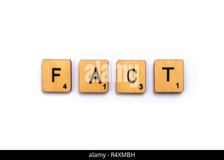 LONDON, UK - JULY 5TH 2018: The word FACT, spelt with wooden Scrabble letter tiles, on 5th July 2018. Stock Photo