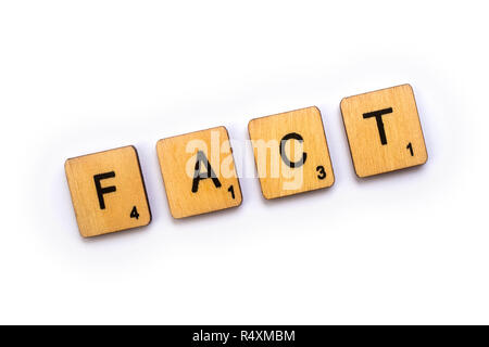 LONDON, UK - JULY 5TH 2018: The word FACT, spelt with wooden Scrabble letter tiles, on 5th July 2018. Stock Photo