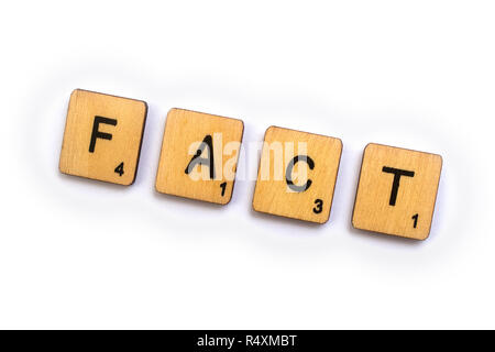 LONDON, UK - JULY 5TH 2018: The word FACT, spelt with wooden Scrabble letter tiles, on 5th July 2018. Stock Photo