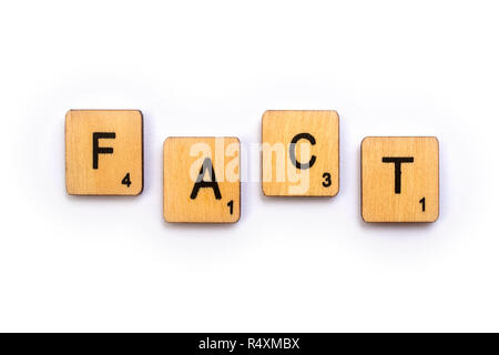 LONDON, UK - JULY 5TH 2018: The word FACT, spelt with wooden Scrabble letter tiles, on 5th July 2018. Stock Photo