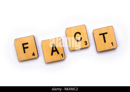 LONDON, UK - JULY 5TH 2018: The word FACT, spelt with wooden Scrabble letter tiles, on 5th July 2018. Stock Photo