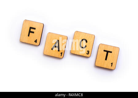 LONDON, UK - JULY 5TH 2018: The word FACT, spelt with wooden Scrabble letter tiles, on 5th July 2018. Stock Photo