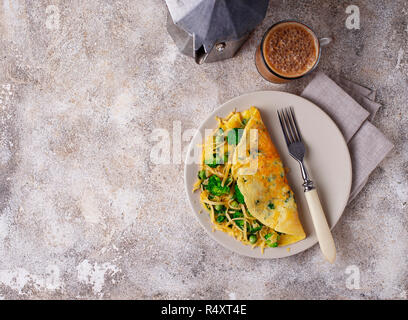 Ketogenic breakfast. Keto low carb omelet with green vegetable and bulletproof coffee Stock Photo