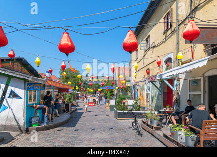 Bars and shops on Pusher Street in Freetown Christiania, a commune in Christianshavn, Copenhagen, Denmark Stock Photo