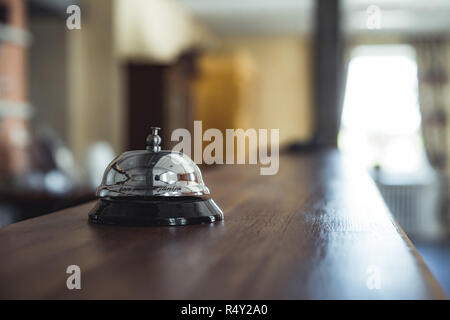 Restaurant Service Bell on the Table in Hotel Reception -  Vintage with Bokeh, Daylight Background - Business Concept Stock Photo