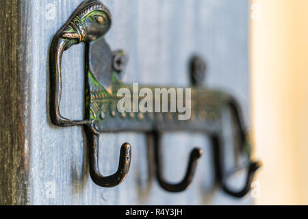 Closeup View of an Antique Cloths Hanger - Wooden Background, Partly Blurred Stock Photo