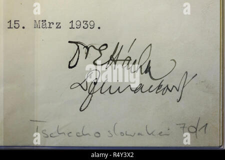 Signatures of the President of Czechoslovakia Emil Hácha and the Minister of Foreign Affairs of Czechoslovakia František Chvalkovský under the Hácha Hitler Protocol on display at the Czech-Slovak Exhibition (Česko-slovenská výstava) in the National Museum (Národní muzeum) in Prague, Czech Republic. The document signed in Berlin on 15 March 1939 by Emil Hácha and František Chvalkovský put the territory and population of Bohemia and Moravia under the protection of the German Reich and ensured that the occupation of the Czech territory would not be resisted by the local people and military. On be Stock Photo