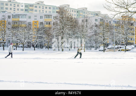 Minsk, Belarus-January 15, 2017: Elderly couple man and woman ski run. Winter fitness. Amateur Cross-Country Skiing Stock Photo