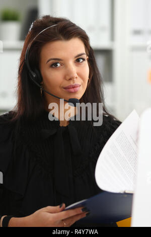 Three call centre service operators at work Stock Photo